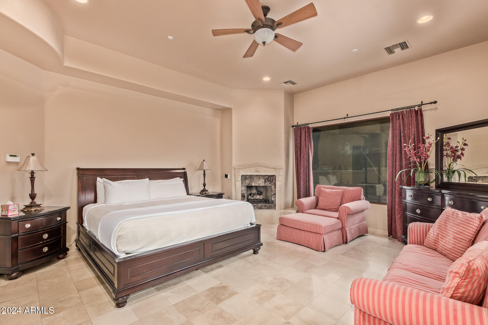 5339 East Royal Palm Road Paradise Valley, AZ 85253 - Photo 62 of 95 a spacious bedroom with a bed couch and a large window