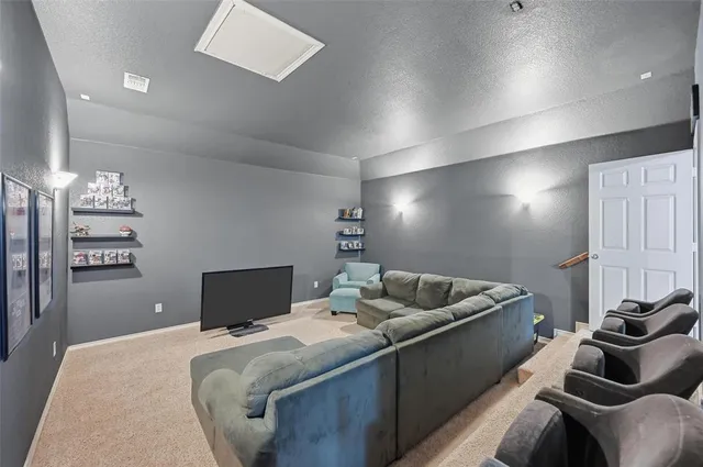 a bedroom with a bed and couch