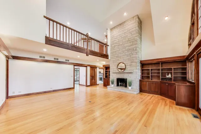 an empty room with furniture and a fireplace