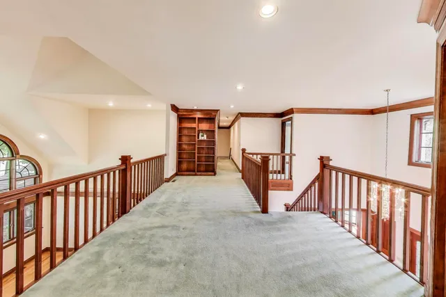 a view of a livingroom with a ceiling fan and window