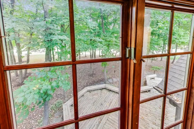 a view of a closet with wooden floor