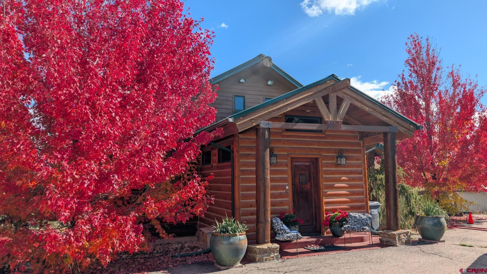 10266 Road 35 Mancos, CO 81328 - Photo 17 of 45 a front view of a house with a tree