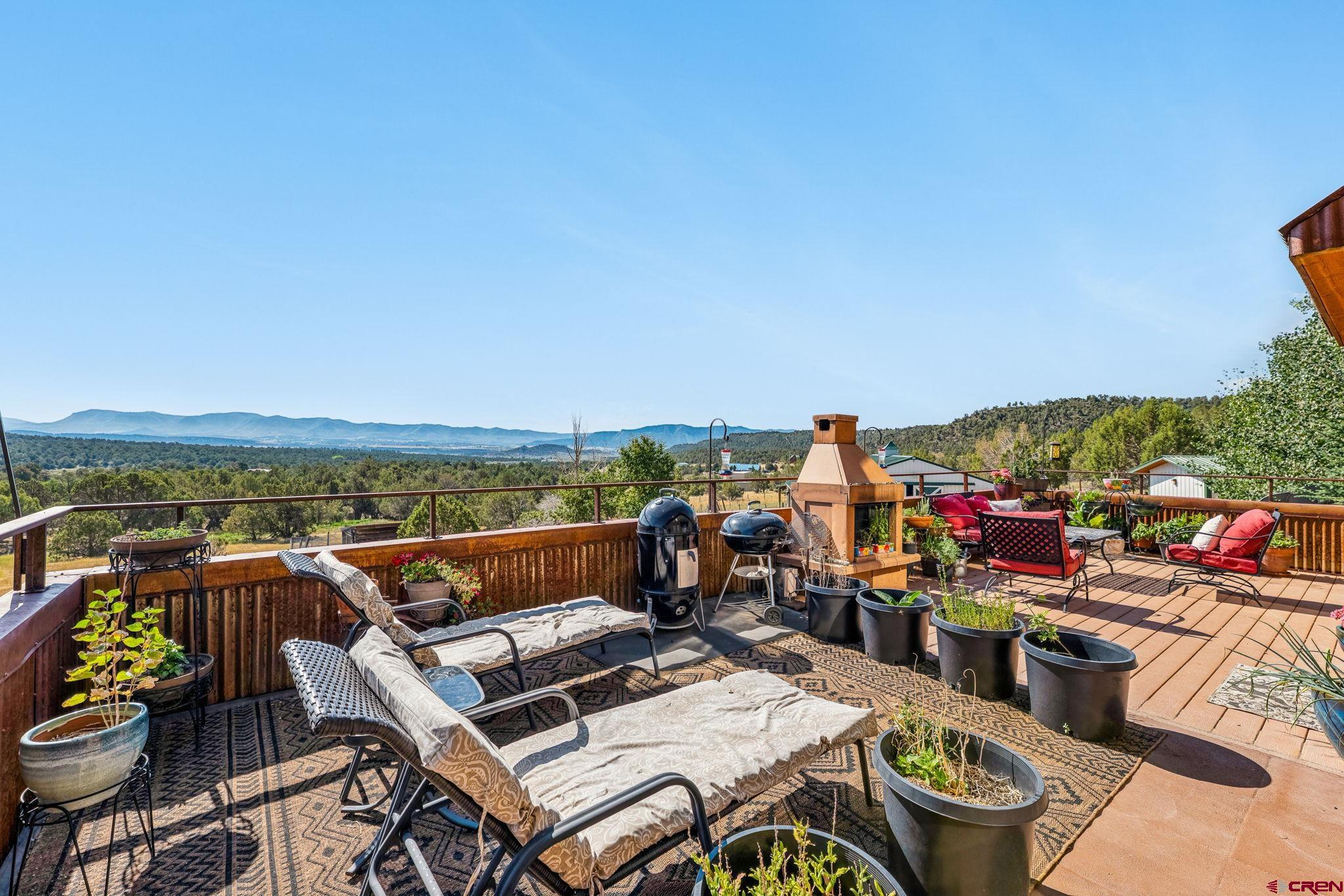 10266 Road 35 Mancos, CO 81328 - Photo 24 of 45 a view of a terrace with furniture and outdoor seating