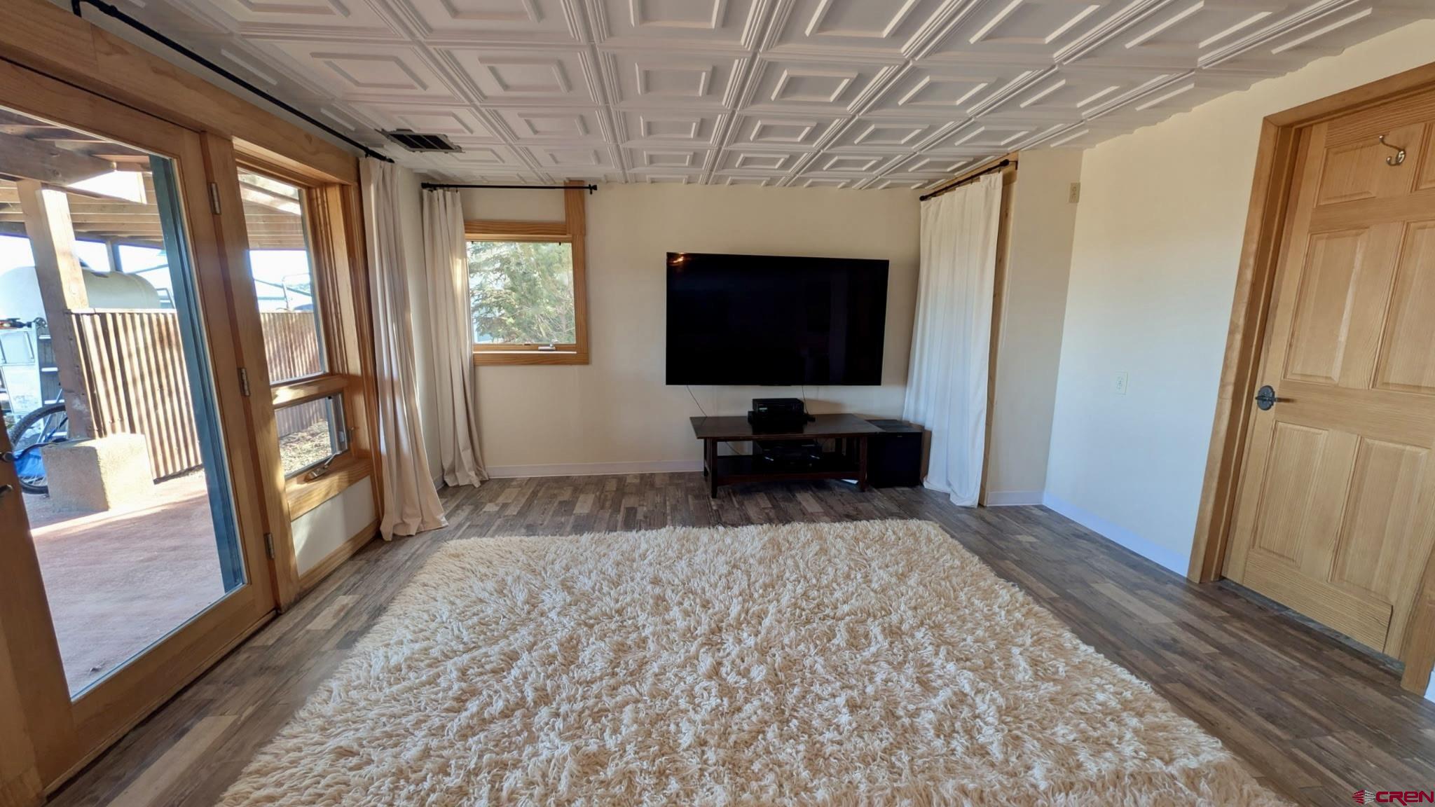 10266 Road 35 Mancos, CO 81328 - Photo 40 of 45 a living room with furniture and a flat screen tv