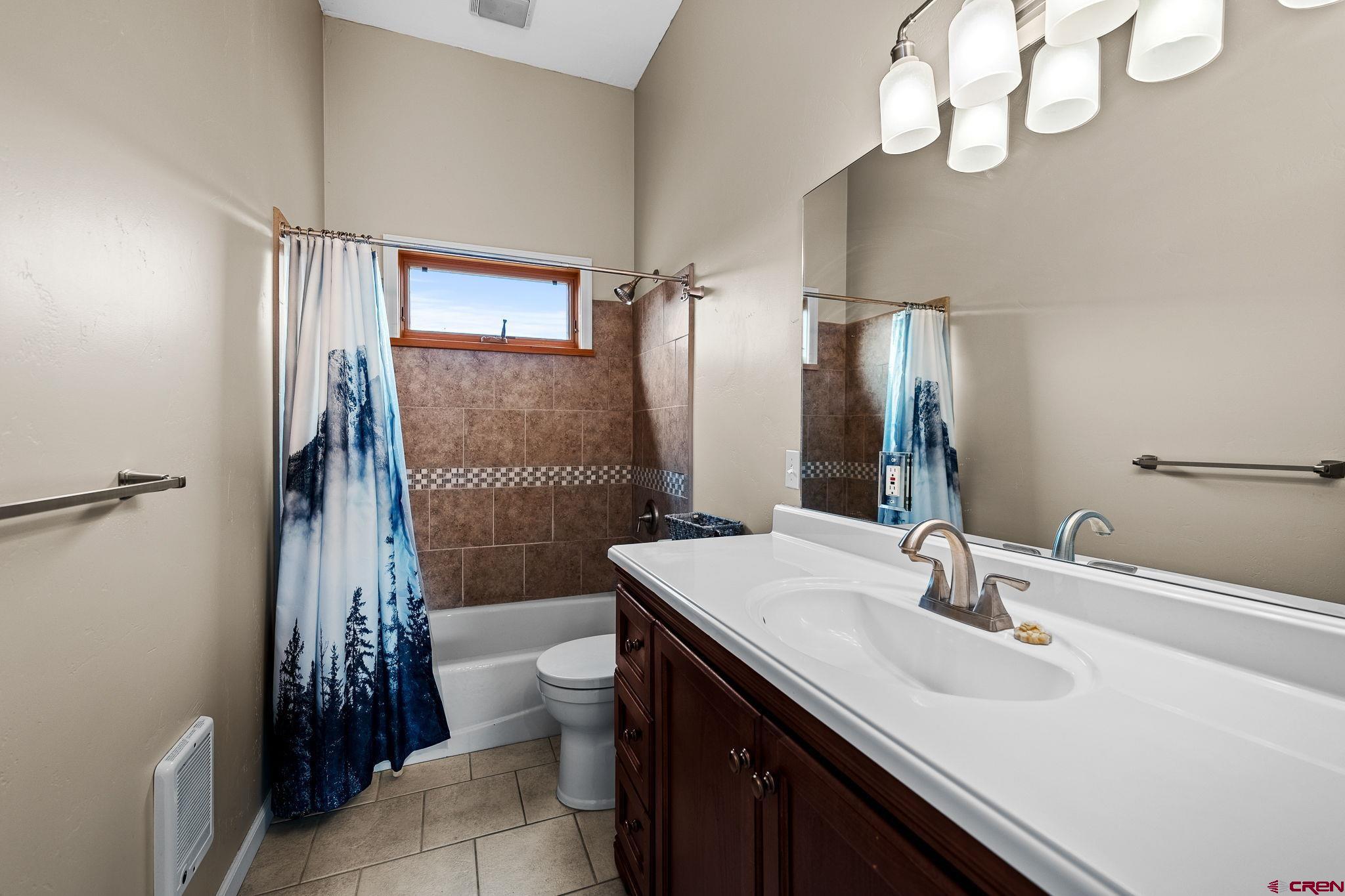 10266 Road 35 Mancos, CO 81328 - Photo 43 of 45 a bathroom with a sink a toilet and shower