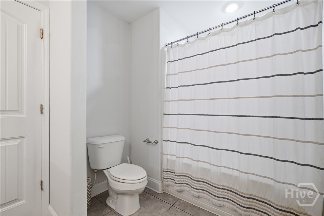 11330 White Bluff Road, Unit 31 Savannah, GA 31419 - Photo 28 of 36 The primary bathroom is large and features a shower/tub combo.