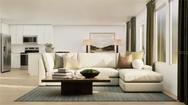 a living room with furniture and a rug