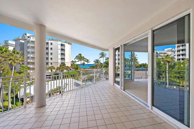 a lobby with furniture and floor to ceiling window