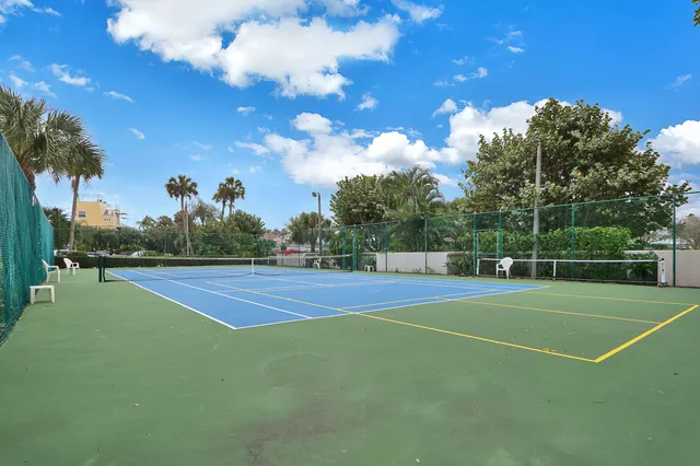 a view of an outdoor space and tennis court