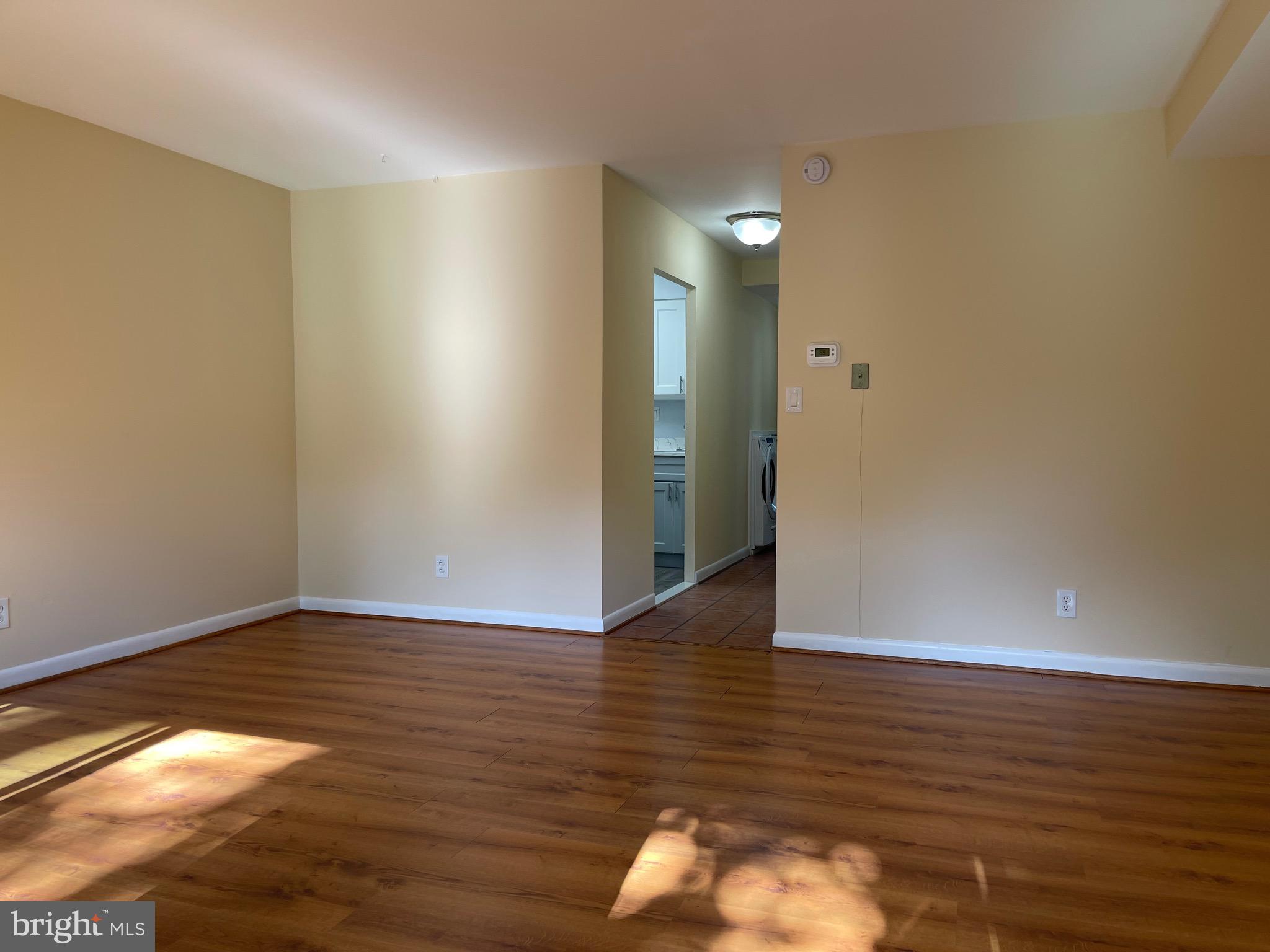 817 Delaware Avenue Southwest, Unit 227 Washington, DC 20024 - Photo 16 of 27 a view of an empty room and wooden floor