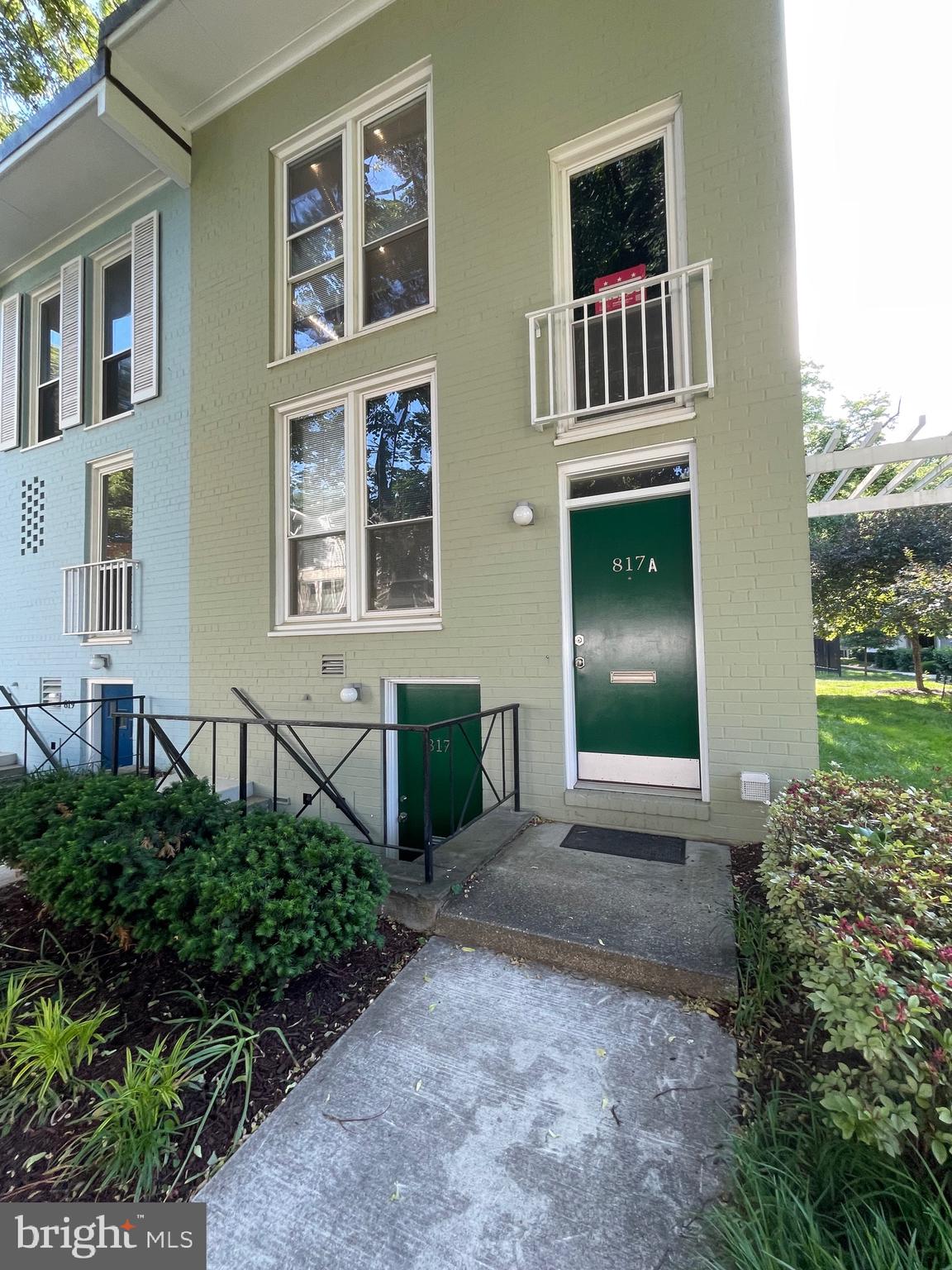 817 Delaware Avenue Southwest, Unit 227 Washington, DC 20024 - Photo 2 of 27 a front view of a house with garden