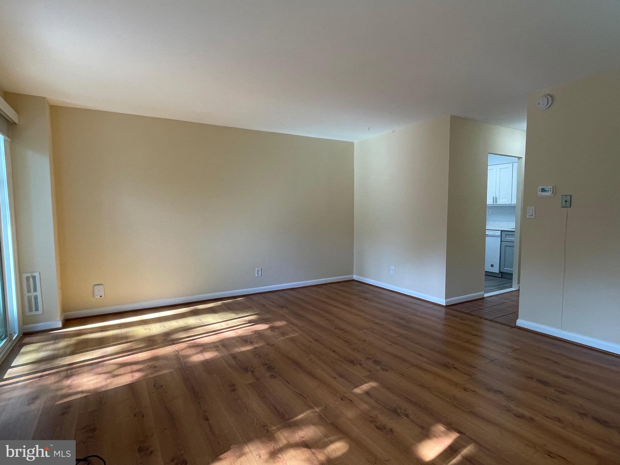 817 Delaware Avenue Southwest, Unit 227 Washington, DC 20024 - Photo 6 of 27 a view of an empty room with wooden floor