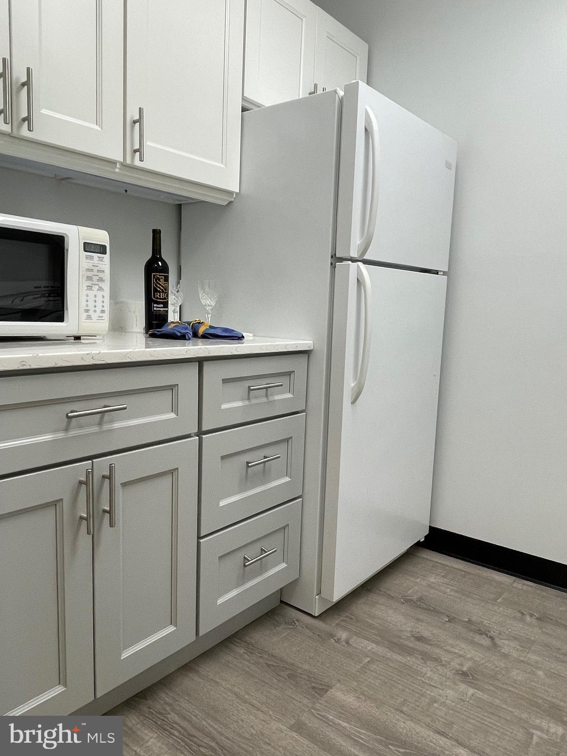 817 Delaware Avenue Southwest, Unit 227 Washington, DC 20024 - Photo 8 of 27 a white refrigerator freezer sitting inside of a kitchen