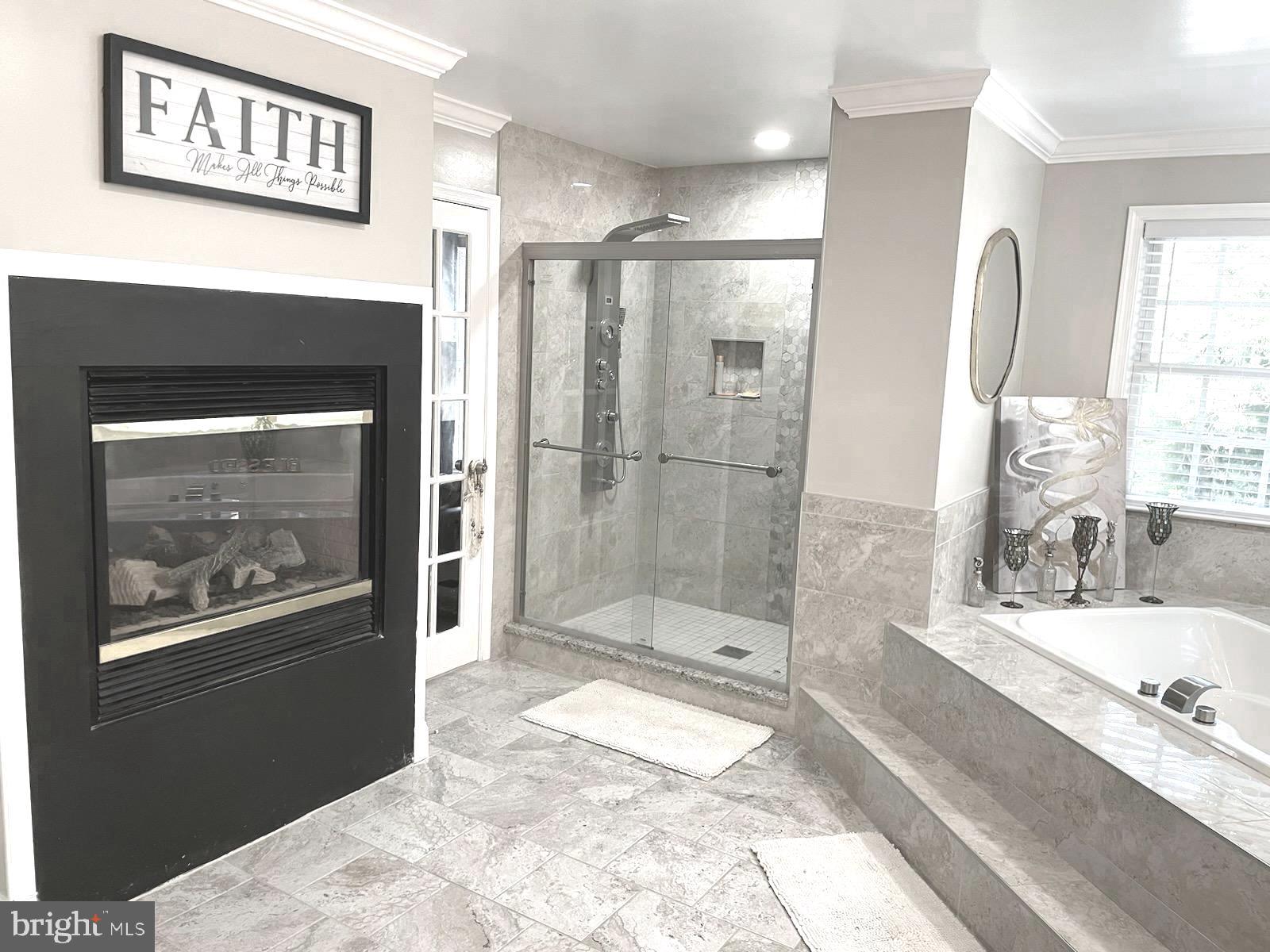 9319 Migan Road Randallstown, MD 21133 - Photo 13 of 32 a bathroom with a bathtub and a shower