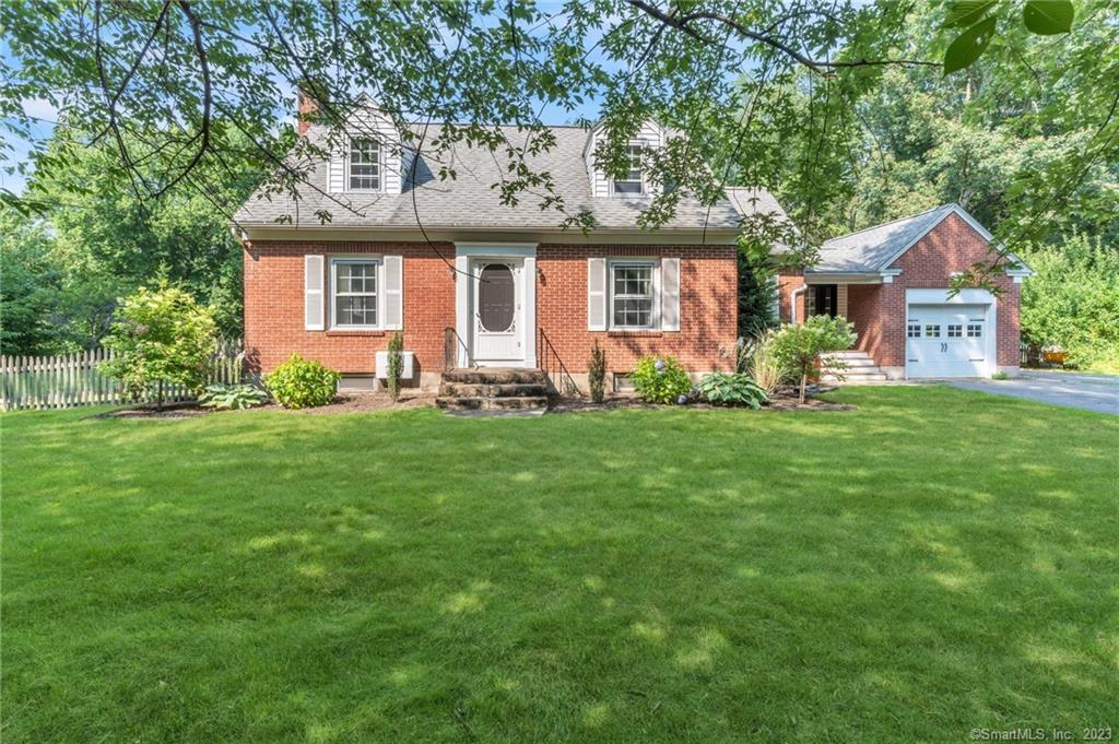 275 Moody Road Enfield, CT 06082 - Photo 1 of 1 a front view of a house with a yard and porch