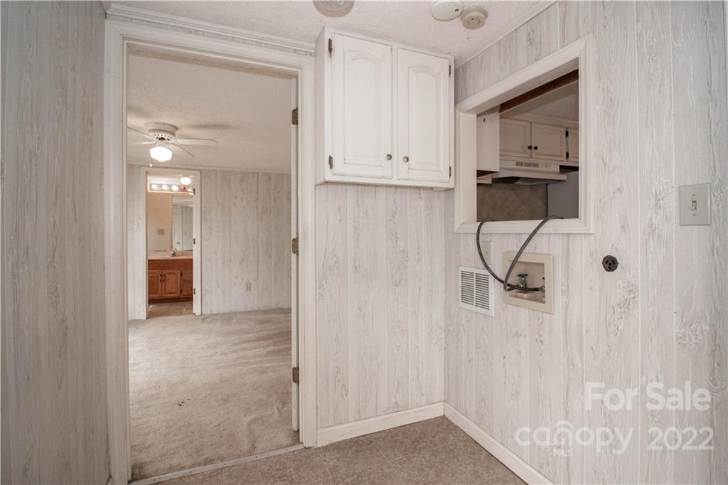 8785 Holdsclaw Road Terrell, NC 28682 - Photo 19 of 35 a view of a hallway with wooden shelves