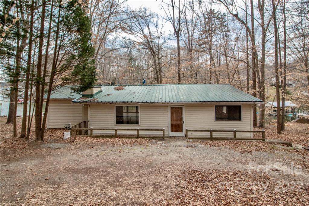 8785 Holdsclaw Road Terrell, NC 28682 - Photo 2 of 35 a view of house with backyard and trees