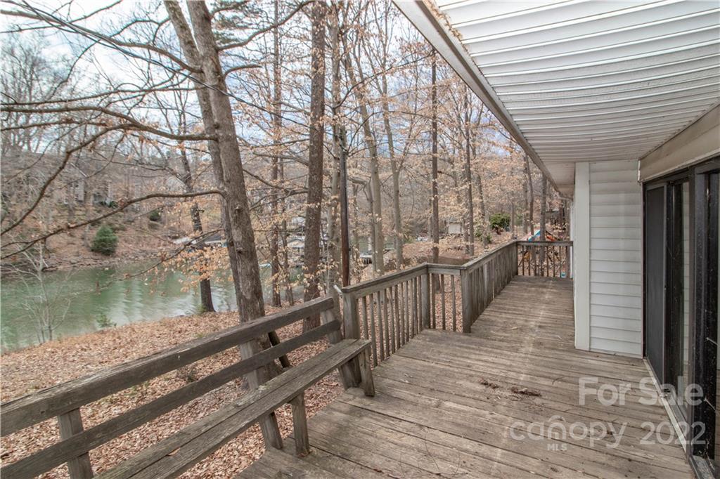 8785 Holdsclaw Road Terrell, NC 28682 - Photo 27 of 35 a view of a wooden deck with a lake view