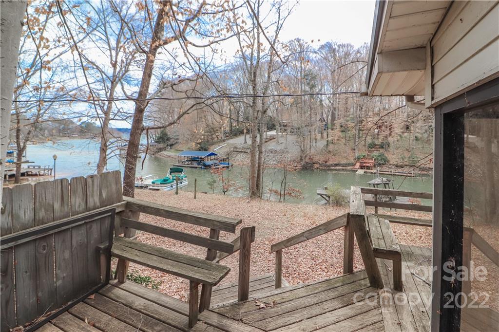 8785 Holdsclaw Road Terrell, NC 28682 - Photo 29 of 35 a view of a patio with table and chairs with wooden floor and fence