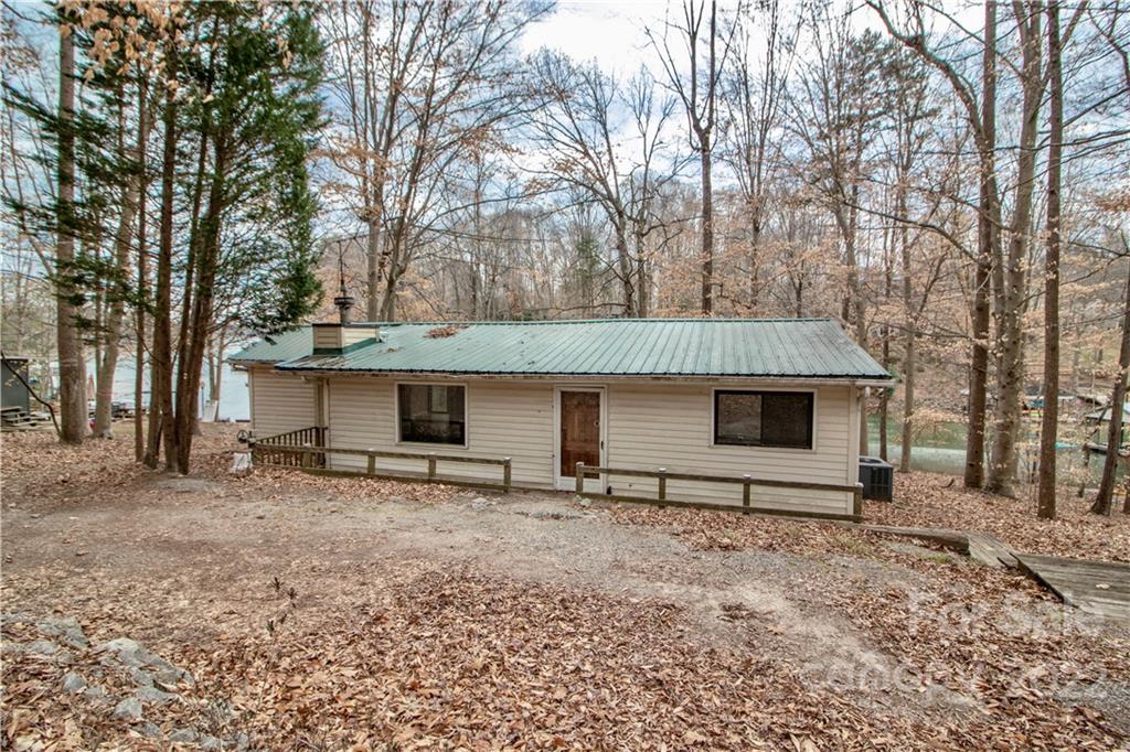 8785 Holdsclaw Road Terrell, NC 28682 - Photo 4 of 35 a view of a house with a yard and trees