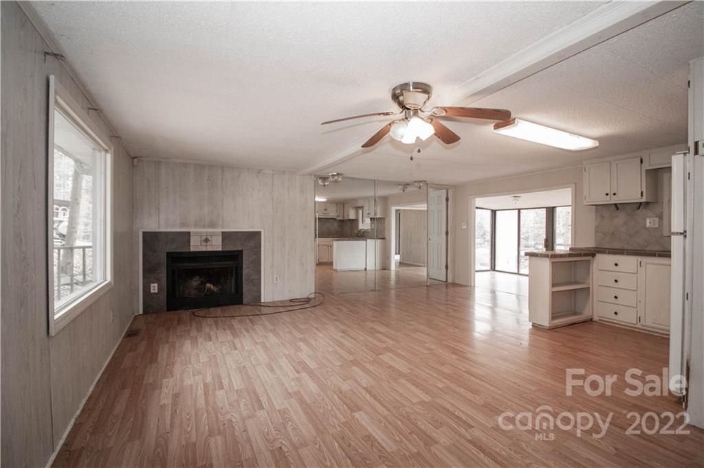 8785 Holdsclaw Road Terrell, NC 28682 - Photo 7 of 35 a view of a kitchen with furniture and wooden floor