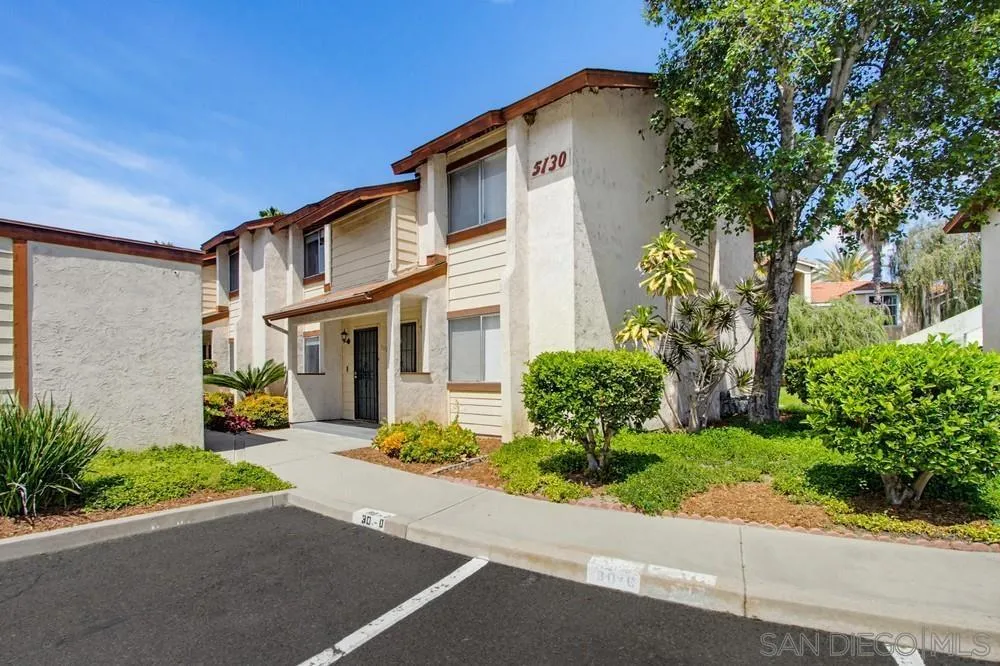 5130 North River Road, Unit B Oceanside, CA 92057 - Photo 33 of 43 a front view of a house with a yard