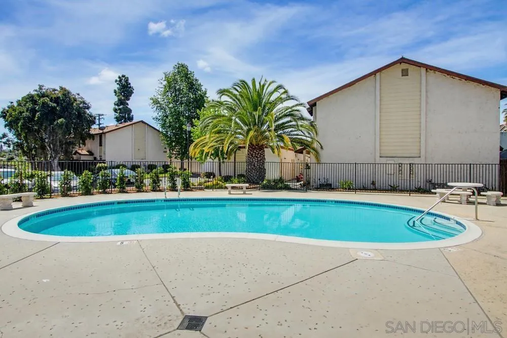 5130 North River Road, Unit B Oceanside, CA 92057 - Photo 40 of 43 a view of swimming pool with outdoor seating and yard in back