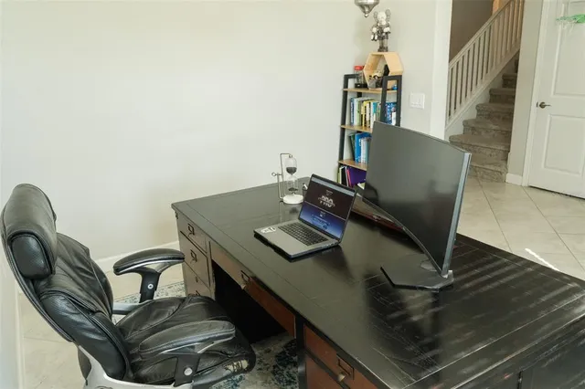 a view of a workspace with furniture