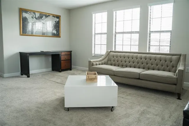 a living room with furniture and a window