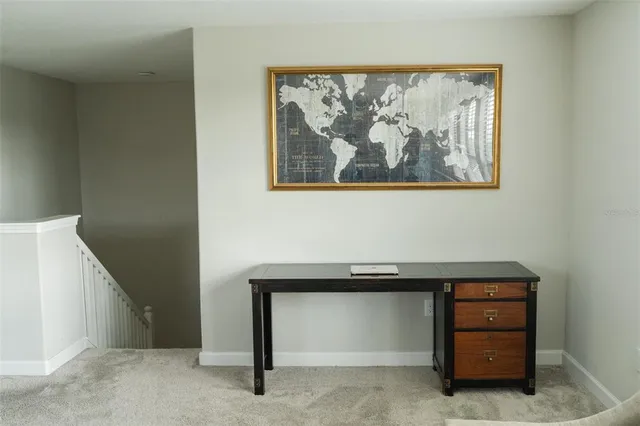 a view of an entryway with a cabinet