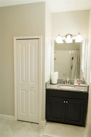 a bathroom with a double vanity sink and a mirror