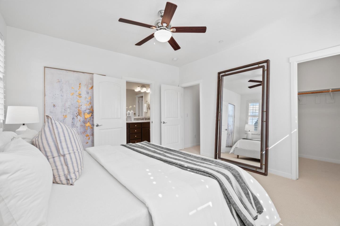 110 Calderon Avenue Mountain View, CA 94041 - Photo 13 of 25 a bedroom with a bed and a chandelier