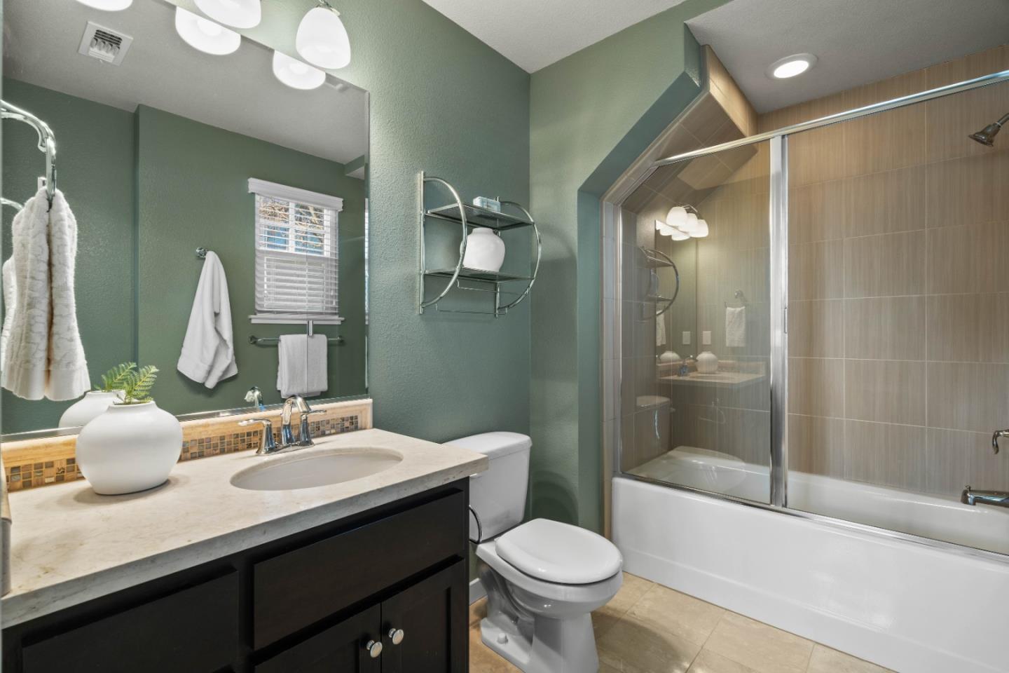 110 Calderon Avenue Mountain View, CA 94041 - Photo 20 of 25 a bathroom with a double vanity sink toilet and shower