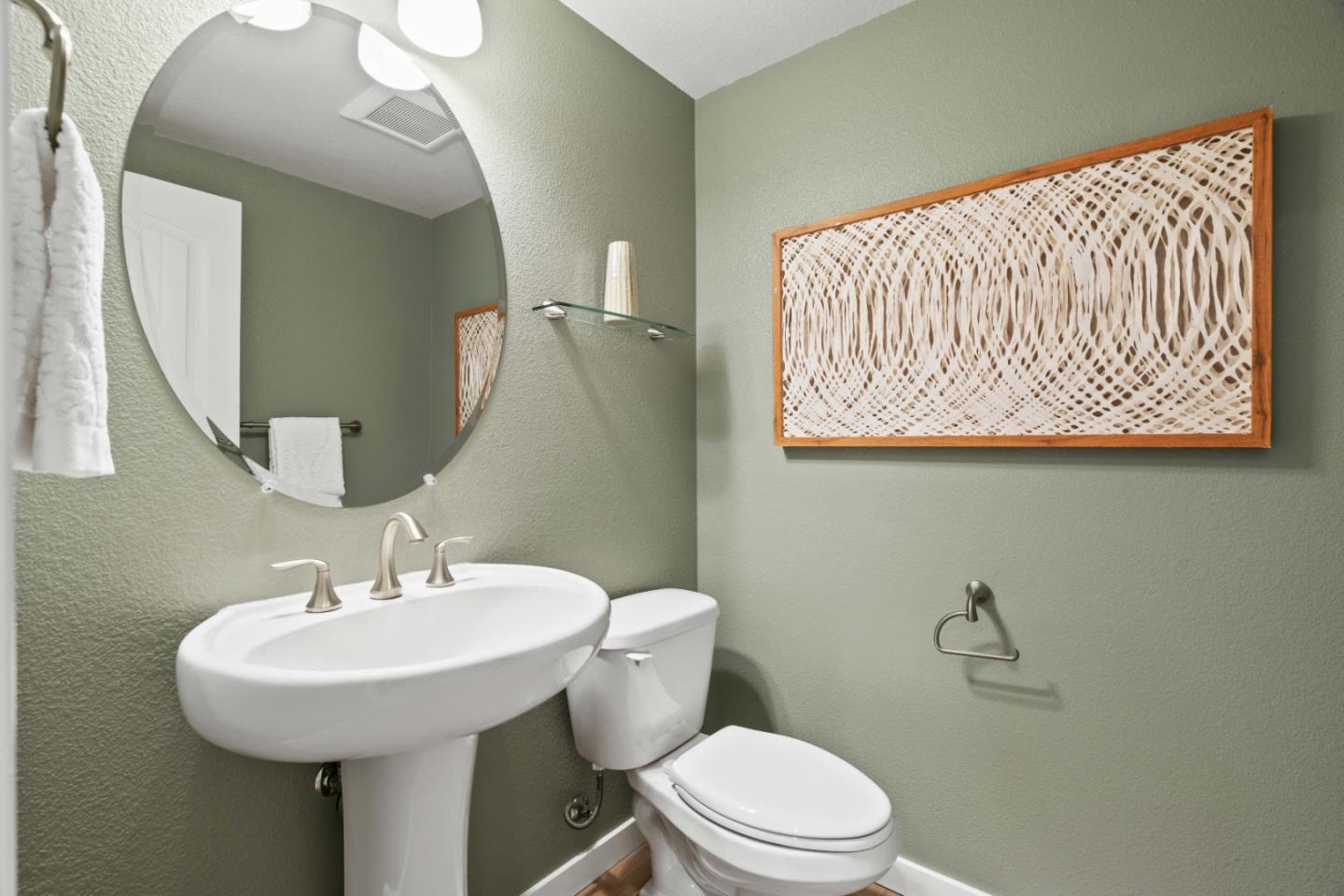 110 Calderon Avenue Mountain View, CA 94041 - Photo 22 of 25 a bathroom with a sink a mirror and toilet