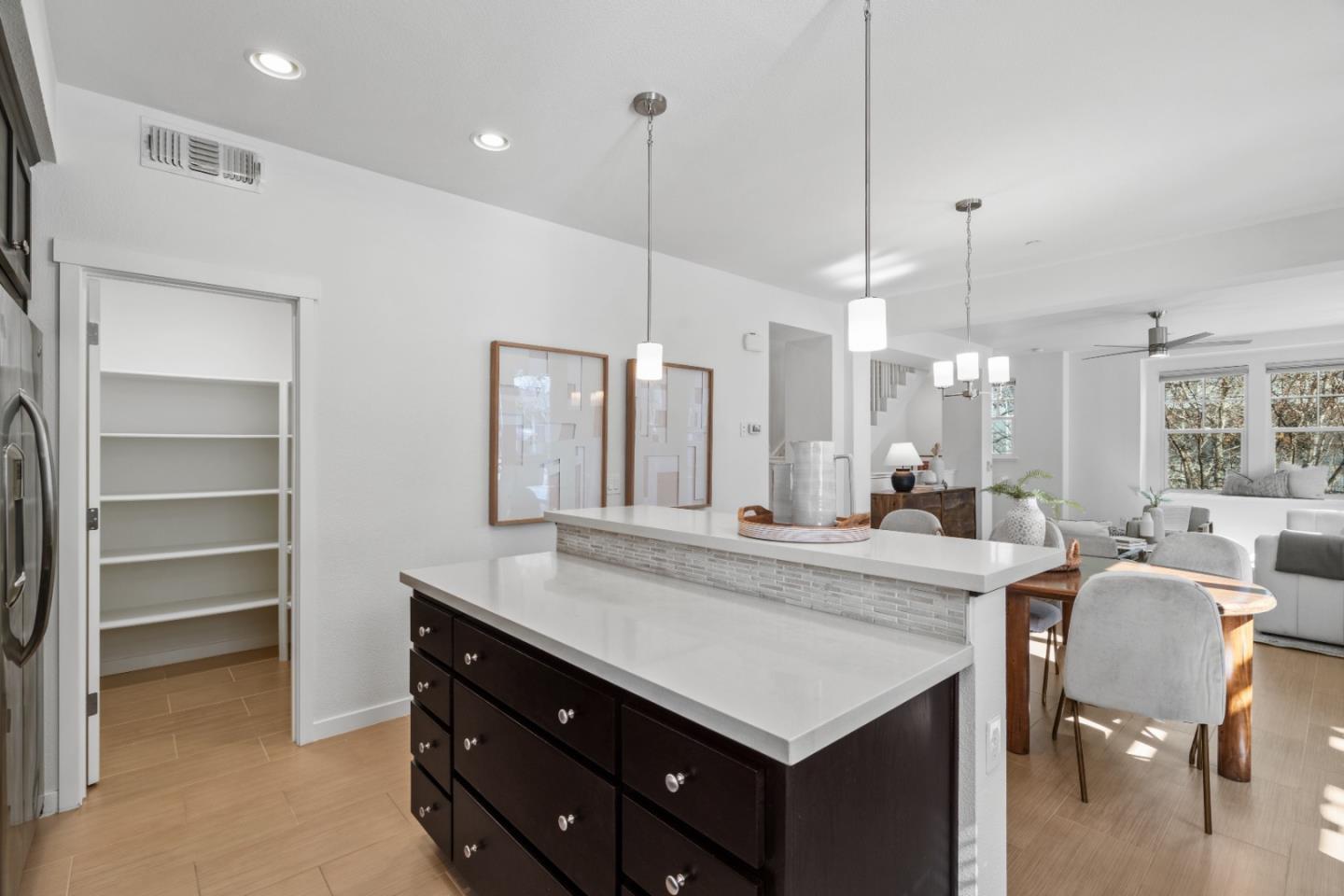 110 Calderon Avenue Mountain View, CA 94041 - Photo 10 of 25 a large kitchen with kitchen island a large island in it
