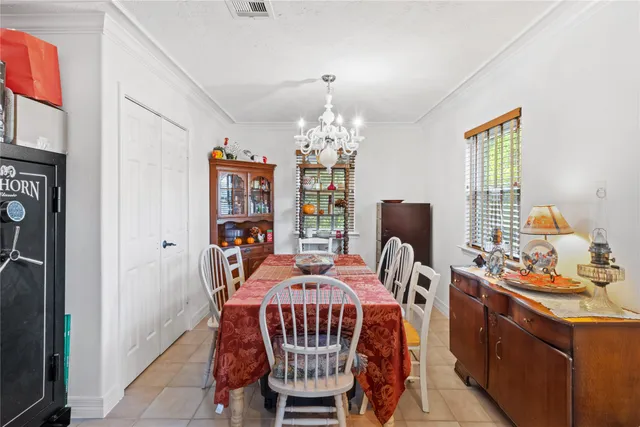 a bedroom with bed and windows