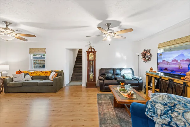 a living room with furniture and a flat screen tv