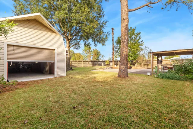 a view of a house with a yard and garage