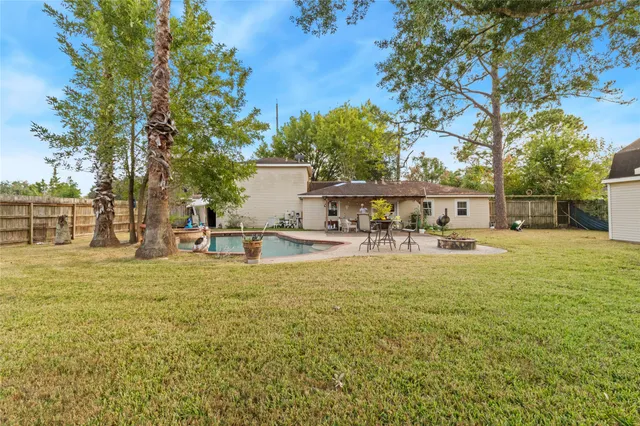 a view of a swimming pool with a patio