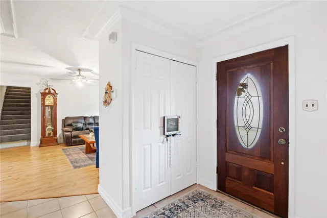 a view of an entryway with wooden floor