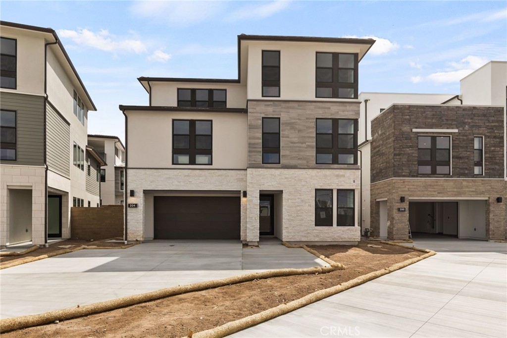 a front view of a house with a garage