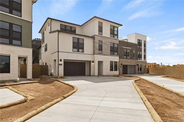 a view of a white building with a outdoor space