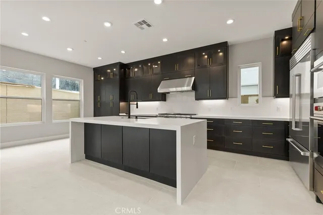 a large bathroom with a sink double vanity and a large mirror