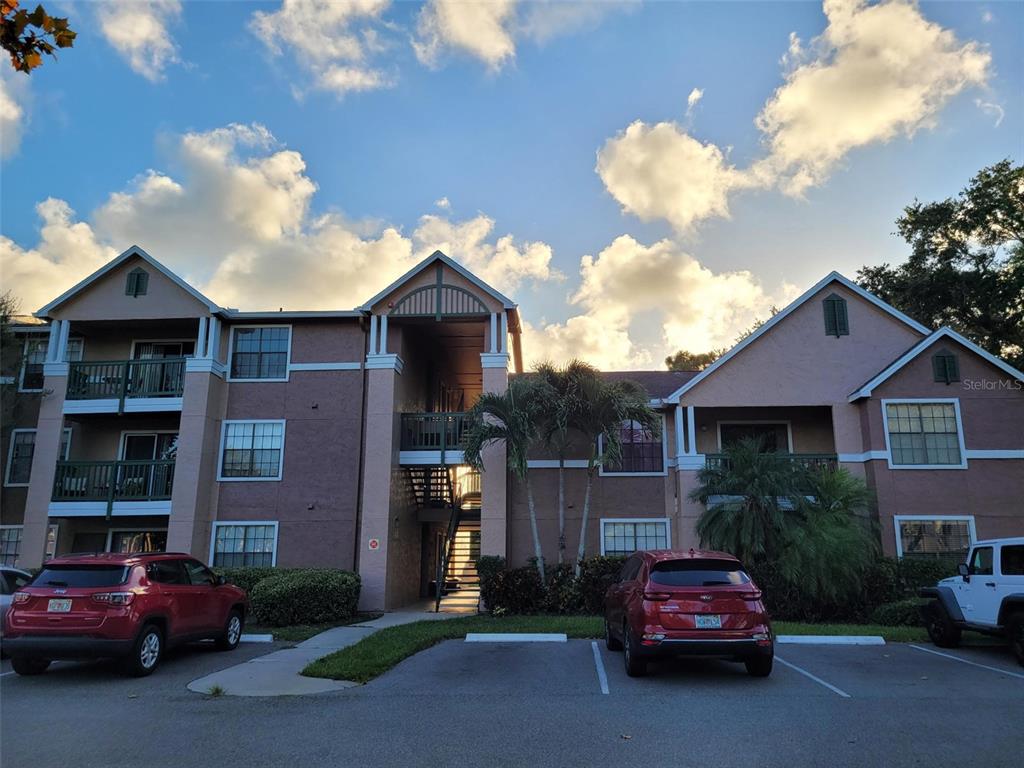 7667 North Wickham Road, Unit 1514 Melbourne, FL 32940 - Photo 1 of 1 a car parked in front of a house