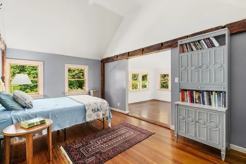 a bed room with a bed and a window