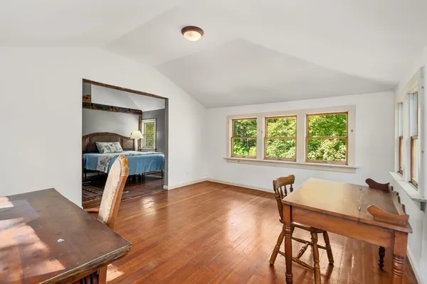 a workspace with furniture and a window