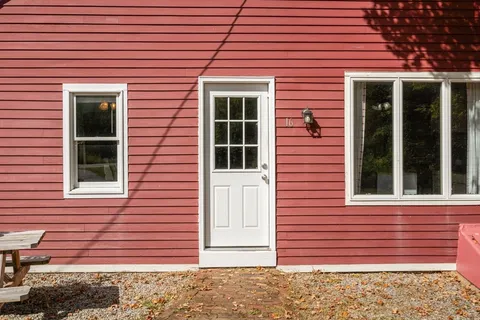 a view of a brick house with front door