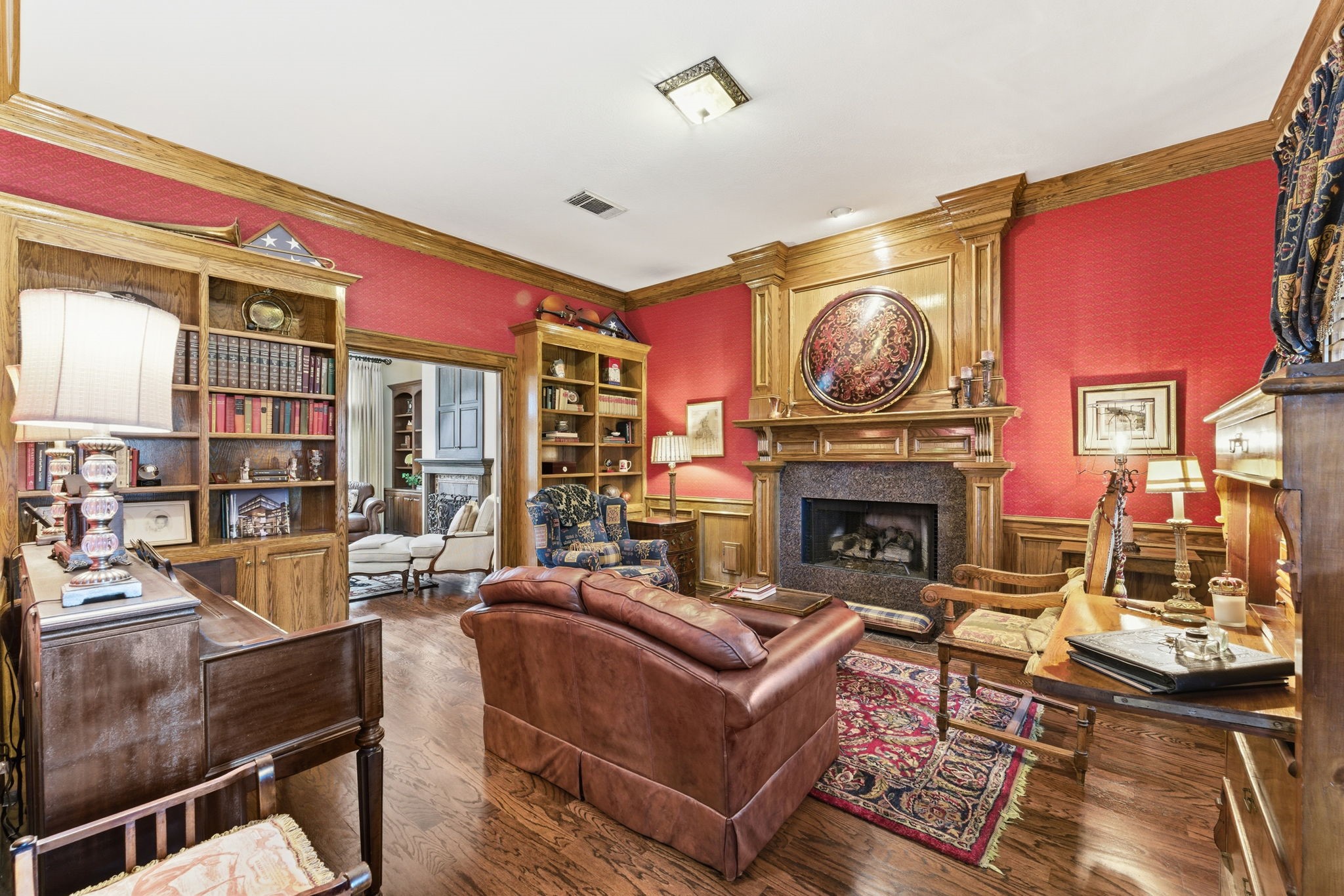 147 North Taylor Point Drive Spring, TX 77382 - Photo 11 of 44 Cozy up in this charming study, where a welcoming fireplace creates the perfect ambiance for productivity and relaxation.