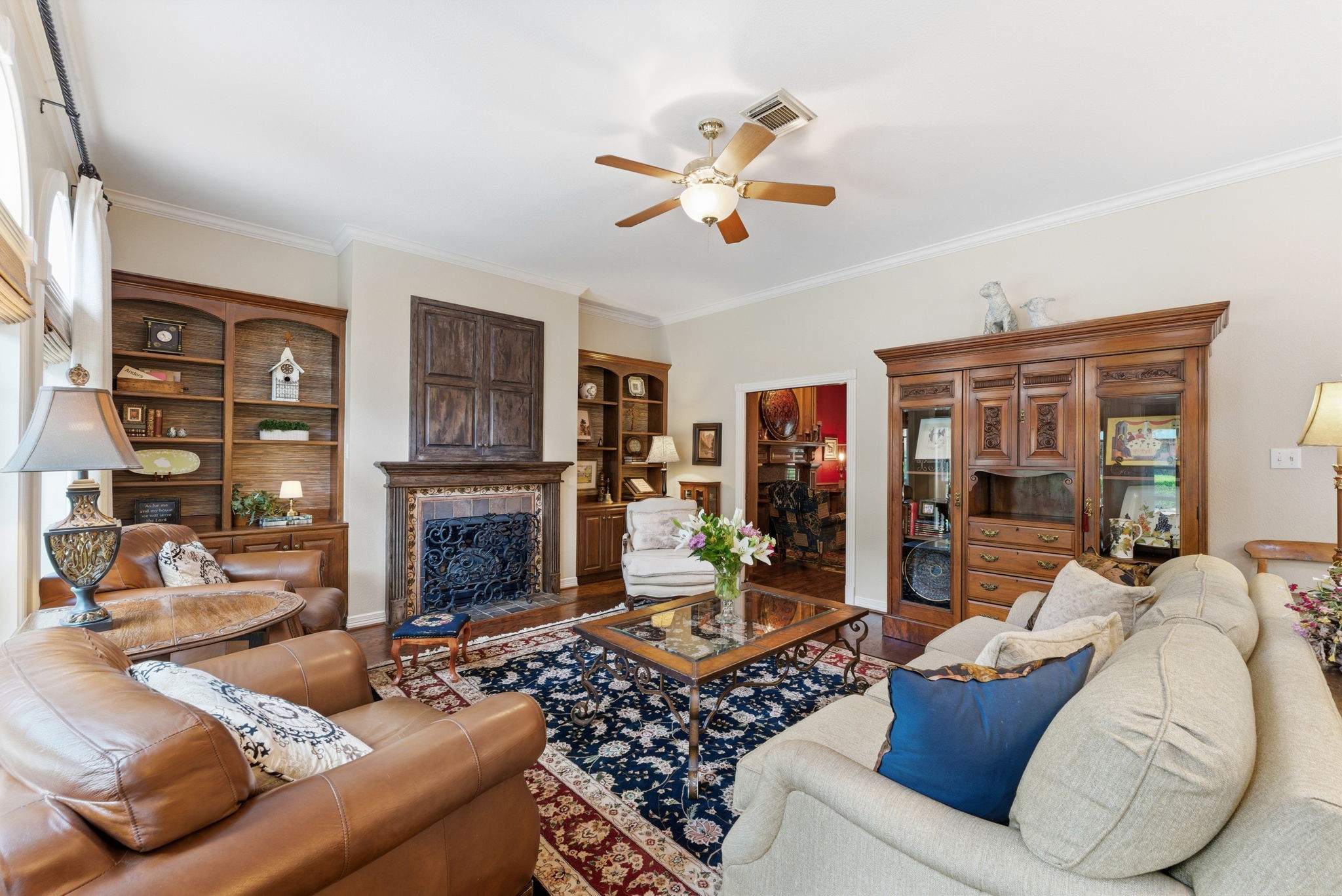 147 North Taylor Point Drive Spring, TX 77382 - Photo 12 of 44 With one of three fireplaces in the home, this family room is an inviting place for relaxation. TV is hidden above the fireplace.