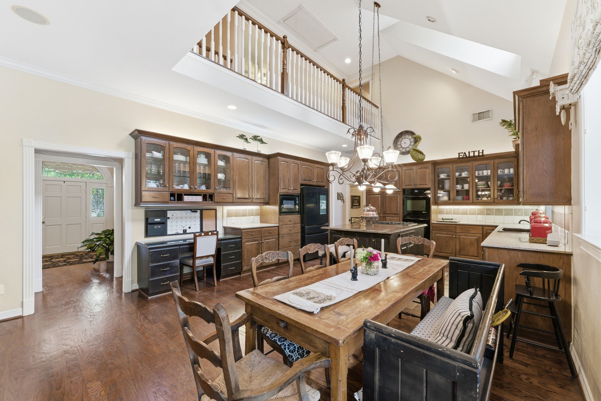 147 North Taylor Point Drive Spring, TX 77382 - Photo 14 of 44 This inviting space seamlessly blends a cozy breakfast nook, functional kitchen, and versatile desk area, perfect for modern living and entertaining.